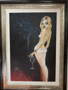 Beneath It All' by Todd White, artwork number 81 of 95, features a blonde woman in a skimpy white ball gown, holding a cigarette and a glass of red wine, against a mostly black background with hints of red. Visible cigarette smoke contrasts against the dark backdrop as she turns to look over her shoulder, her pose sultry yet comical.