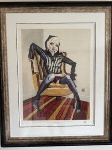 Provocative artwork 'Hard Candy' by Todd White, featuring a woman in black suspenders and a religious-themed top, seated provocatively against a grey and red striped backdrop.