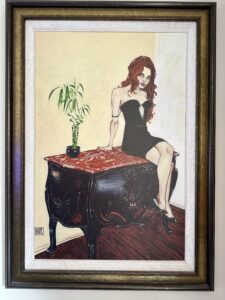 'You Know That's An Antique' by Todd White depicts a redhead in a black cocktail dress, sitting on a black antique sideboard with a red top, wearing high heels, legs dangling, with a plant beside her.