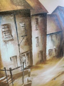 painting of a row of old houses on a sloping street