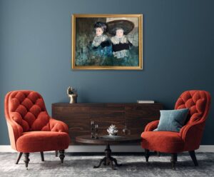 artwork 'Les Filles de Haarlem' by Richard Burlet displayed on a wall in a stylish room with red armchairs