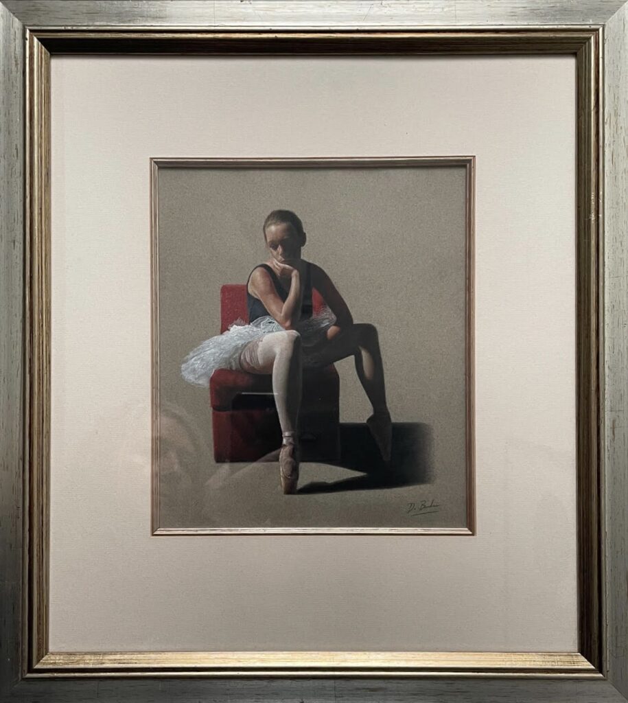 A ballet dancer sitting on a chair, reflected on the floor, with a spotlight casting shadows.