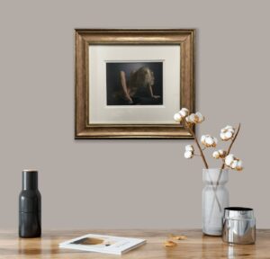 framed artwork titled 'Eternity 2' by Darren Baker on a grey wall above a wooden table with a vase of cotton stems