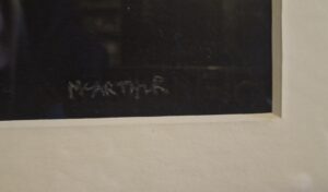 Close-up of Patsy McArthur's signature on artwork titled 'Deliberations'.