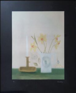 painting of daffodils in a vase next to a candlestick