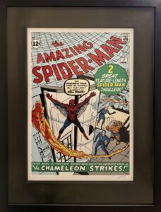 Cover of The Amazing Spider-Man #1 comic book by Stan Lee, featuring Spider-Man swinging through the city