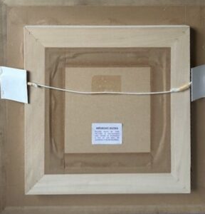 backside view of a framed artwork labeled 'untitled' by artist Kerry Darlington with hanging wire and cardboard edges