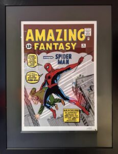 Cover of Amazing Fantasy #15 featuring Spider-Man swinging between buildings