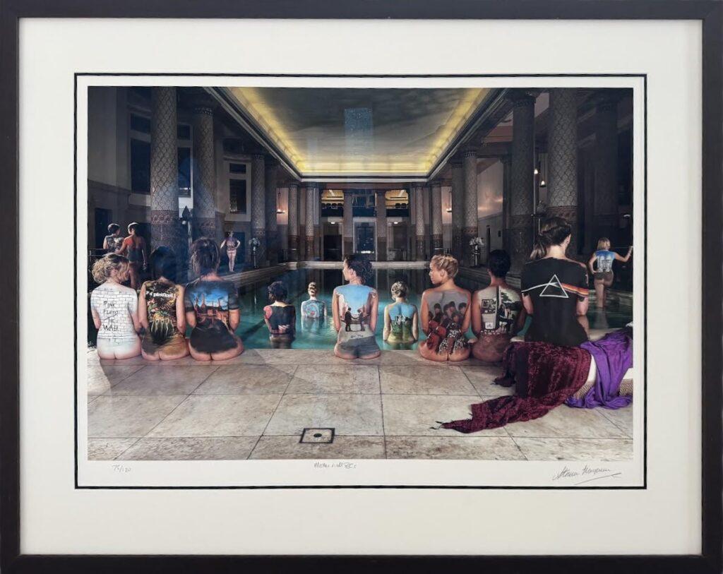 Framed artwork displaying a series of Pink Floyd album covers painted on the backs of women by a swimming pool.