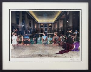 Framed artwork displaying a series of Pink Floyd album covers painted on the backs of women by a swimming pool.