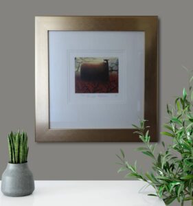 framed artwork titled 'The Last Temptation' by Mackenzie Thorpe displayed on a wall