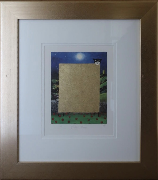 framed artwork titled 'Golden Sheep' by Mackenzie Thorpe depicting a golden rectangular shape in a landscape under a moonlit sky