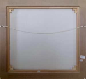 back view of a framed artwork with hanging wire and corner supports