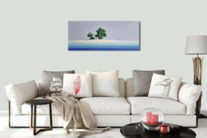 seascape painting by Henderson Cisz hanging above a modern sofa