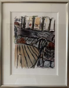 Framed artwork by Bob Dylan featuring a street scene with chairs and columns.