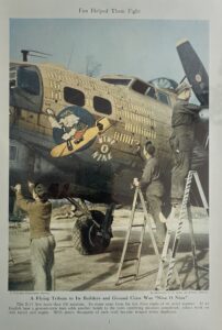 Vintage military aircraft with cartoon artwork being painted by soldiers