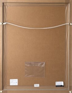 back of a framed artwork with wire and labels