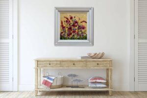 artwork titled 'Poppies in Pink' by Rozanne Bell displayed on a white wall above a wooden console table