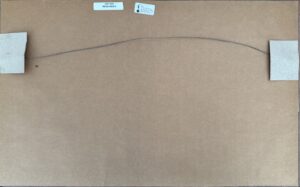 Back of a framed artwork with hanging wire and labels
