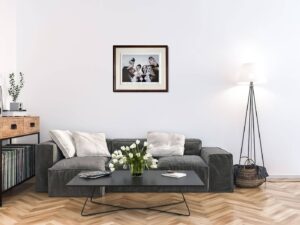 modern living room with Stealing Kisses artwork by Todd White on the wall