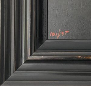 close-up of framed art with signature and edition number in red