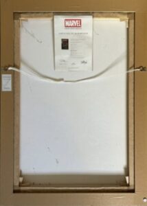 Framed artwork titled 'The Avengers - King-Size Special #2' by Stan Lee, viewed from the back with hanging wire and certificate of authenticity.